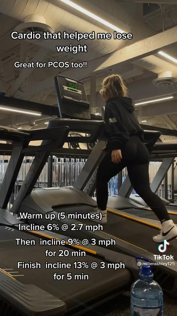 a woman is running on a treadmill