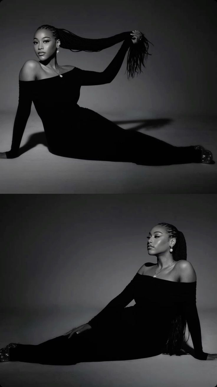 a black and white photo of a woman laying on the ground