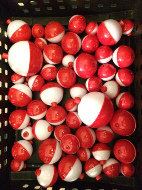 red and white candy apples in a black basket