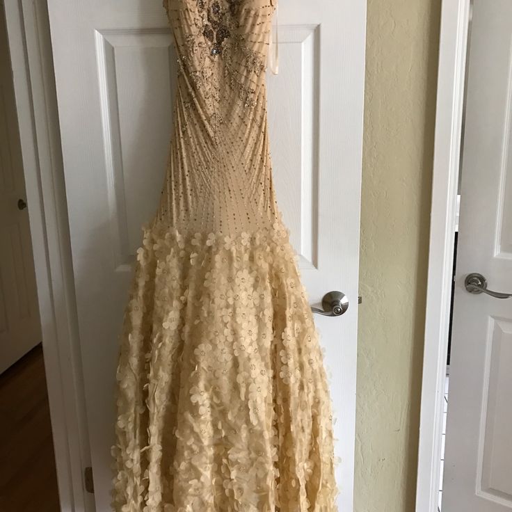 a dress hanging on a door in a room