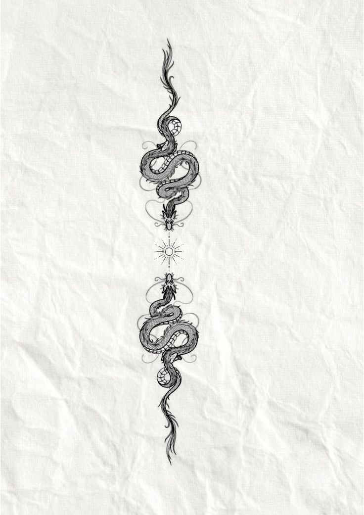 a black and white drawing of a snake on a piece of paper with writing underneath it