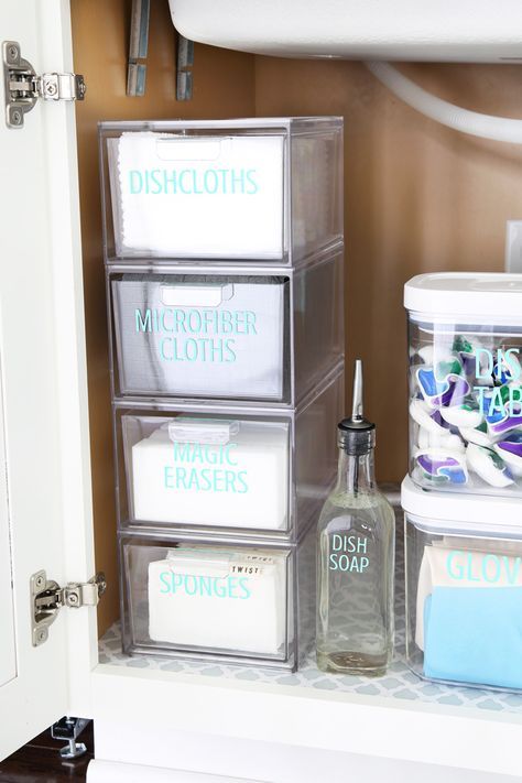 the bathroom is organized with clear plastic containers