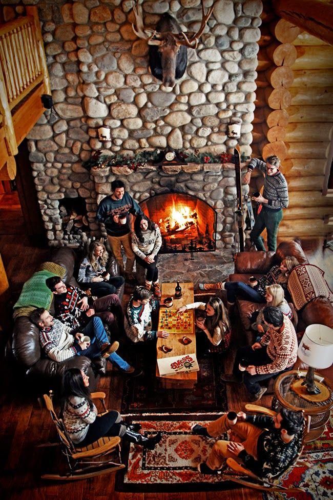 a group of people sitting around a fire place