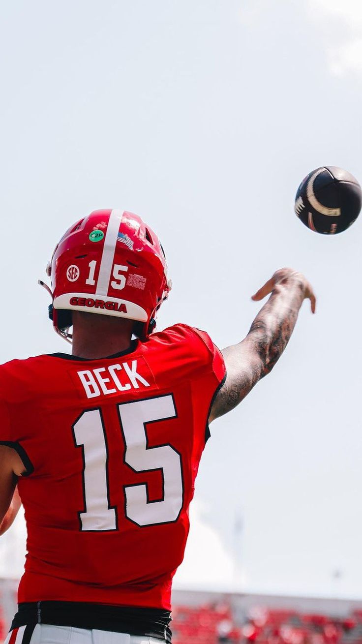 a football player throwing a ball in the air