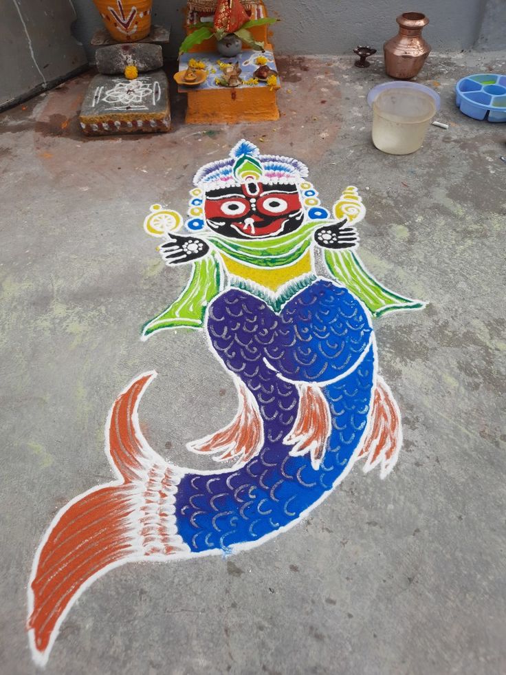 a colorful fish is painted on the ground