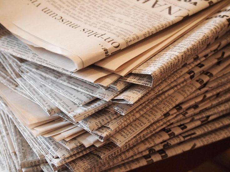 a stack of newspapers stacked on top of each other