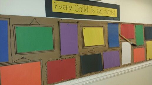 a bulletin board with many different colored squares on it and a sign that says every child is art