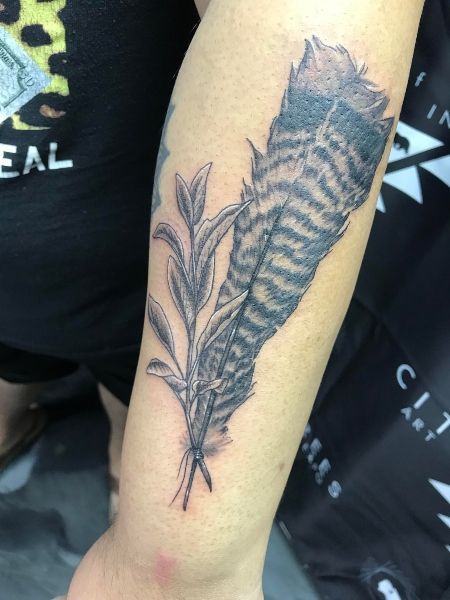 a person with a tattoo on their arm