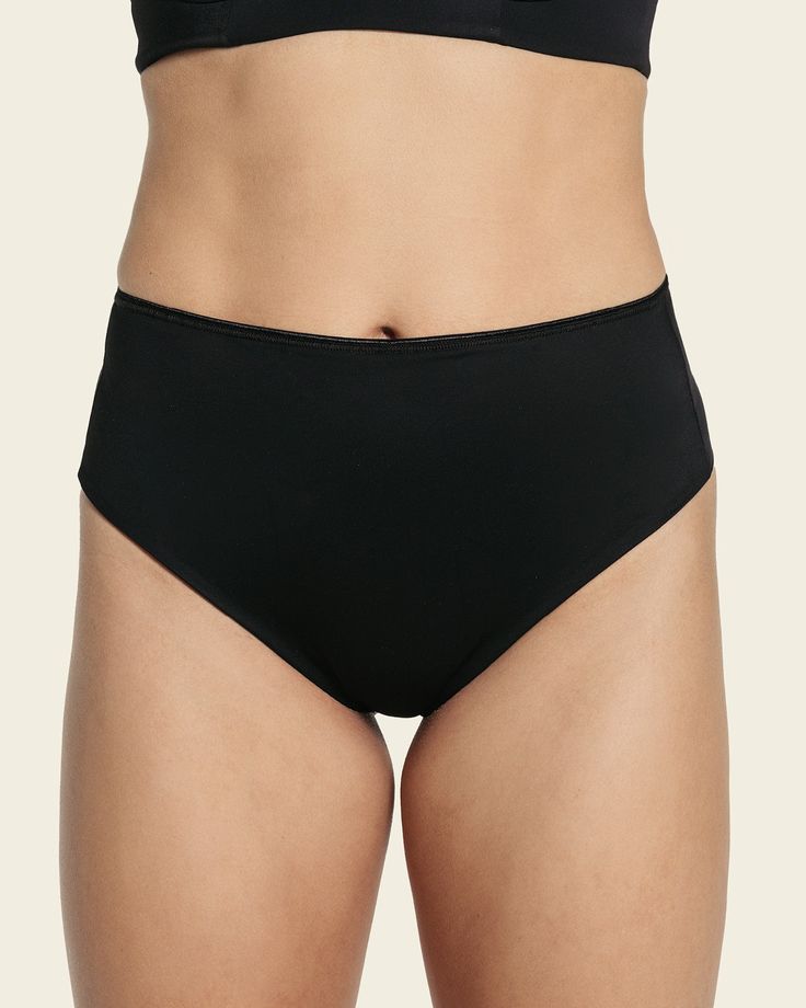 Minimalistic style meets effective shaping! This innovative shaper panty is made of our trademark DuraFit® fabric, double-layered in the front for firm compression to flatten the tummy, single-layered in the back for a comfortable fit. It's high-waisted with high sides for shaping coverage. The thong-style back provides a totally invisible look under clothes. Its minimal coverage also serves to not flatten the cheeks, instead lifting and separating. If you're a thong lover, this seamless shaper panty is perfect for you - it flawlessly combines compression, comfort, and panty line-free style. Compressive Shapewear Bottoms With Built-in Bra, Compressive No-show Smoothing Shapewear, Solid Color Brief Shapewear Bottoms, Full Coverage Shapewear Bottoms With Contoured Waistband, Full Coverage Smoothing Swimwear With Shaping Fit, Full Coverage Smoothing Shaping Swimwear, Sleek Compressive Seamless Bottoms, Sleek Compressive Seamless Shapewear, Shapewear Bottoms With Contoured Waistband And Stretch