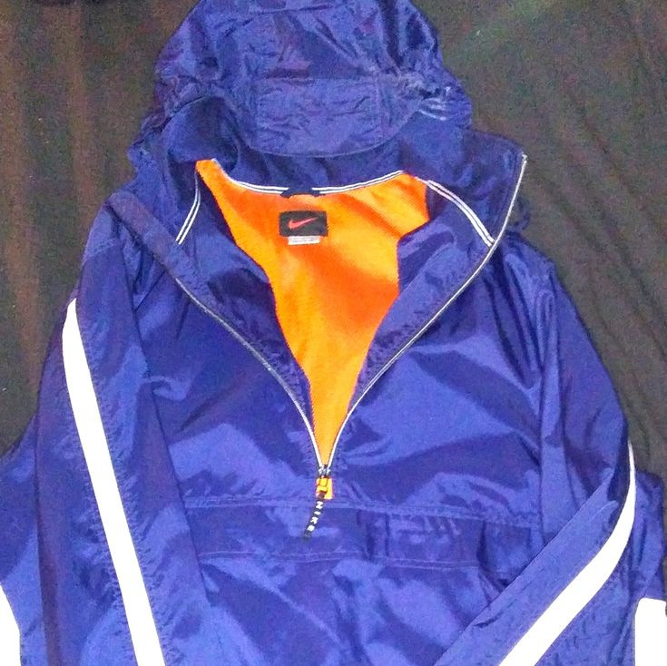 Nike Pullover Hooded Half Zip Windbreaker Jacket Brand New Without Tags Never Worn No Issues Perfect Mid-Heavyweight Pullover Hooded Jacket Hood Rolls Up Into Collar Kangaroo Pouch Side Zippered Front Pockets Vented Backside Middle Rugged Material Drawlstring Collar/Hood/Lower Cuff Nwot 100% Pet Free Smoke Free Home And Environment 5 Star Seller Shop With Confidence Super Fast Shipping Nike Windbreaker With Adjustable Hood For Fall, Nike Casual Windbreaker For Hiking, Casual Nike Windbreaker For Hiking, Fall Sports Outerwear With Kangaroo Pocket, Blue Hoodie Outerwear For Outdoor, Sporty Orange Windbreaker For Fall, Casual Blue Hoodie Windbreaker, Blue Sports Windbreaker For Fall, Orange Sporty Windbreaker For Fall