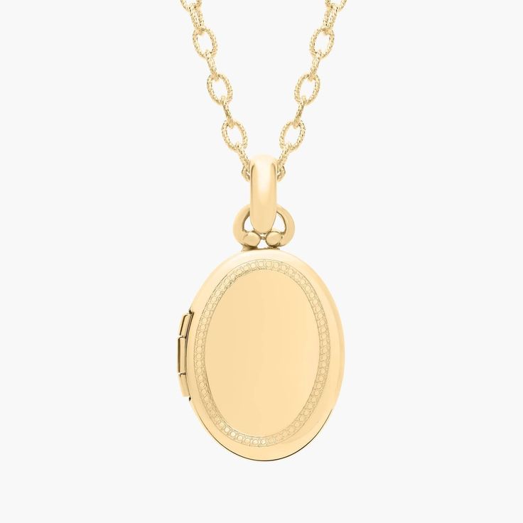 Carry loved ones close with this premium oval locket crafted in 14k yellow gold that opens with a snap clasp to present two photos. Suspended from a forzatina chain necklace, this substantial locket can be engraved on the front for a personalized gift. Classic Oval Locket Necklace Stamped 14k, Dainty Gold Oval Locket Necklace, Classic 14k Gold Locket Necklace With Polished Finish, Classic Oval Link Locket Jewelry, Yellow Gold Oval Locket Jewelry, Oval Yellow Gold Locket Jewelry, 14k Gold Locket Necklace With Oval Pendant For Anniversary, 14k Gold Oval Link Locket Jewelry, Elegant Oval Locket Necklace With Adjustable Chain