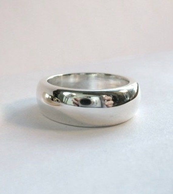 This is a beautiful, heavy sterling band ! This ring is very comfortable and makes a statement on it's own. This piece is great to wear everyday. It is ever so slightly tapered and measures 7.5mm to 8mm wide. The depth is 3mm. This ring can be custom made up to a size 8. This ring can be ordered in silver, gold and platinum. Classic Sterling Silver Wide Band Promise Ring, Silver Thick Band Timeless Style, Classic Sterling Silver Wide Band Ring With Polished Finish, Classic Thick Band Ring In Sterling Silver, Silver Timeless Thick Band, Silver Dome Ring With Round Band For Everyday, Timeless Silver Thick Band, Classic Wide Band Ring In Sterling Silver, Everyday Sterling Silver Wide Band Ring