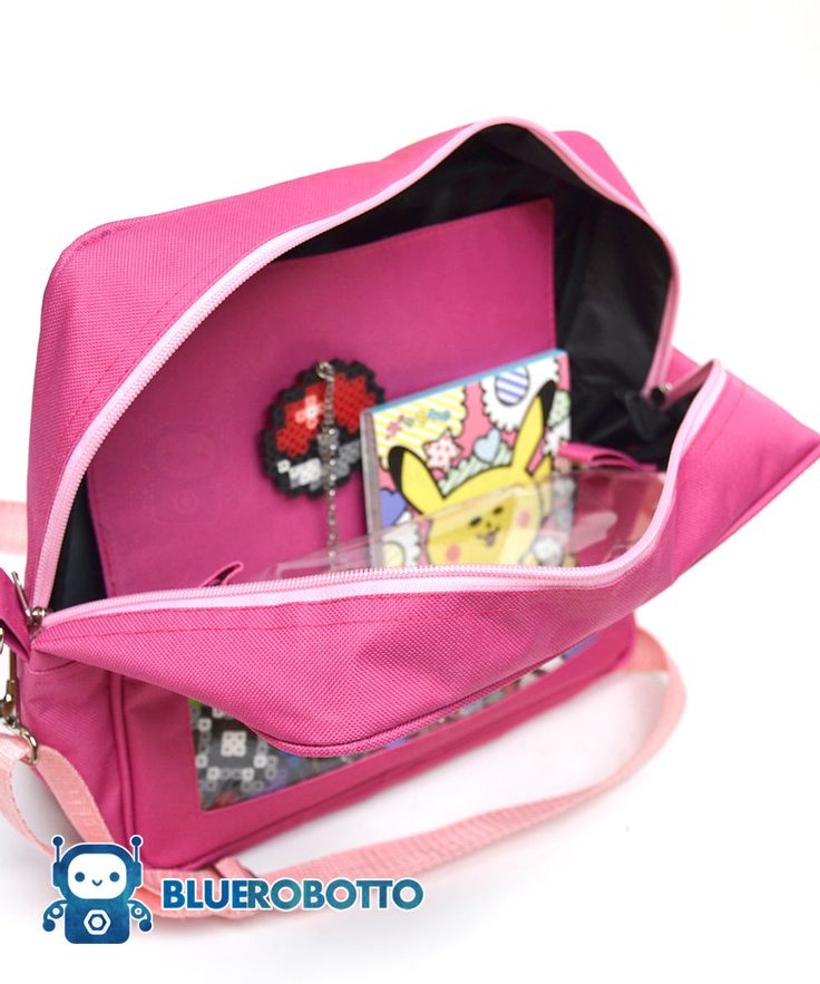 "IMPORTANT: All products are made to order. Orders take up to 4 weeks to be made and shipped. . Welcome to BlueRobotto .-.-.-.-.-.-.-.-.-. With this stylish messenger bag you can show off your fandom, your travel pics or even your pet photos everywhere you go. The front of the bag is transparent, with a window looking to the interior panel, where you can customize it however you like, place your pins, buttons, pictures, keychains and even small plushies. We used some safety pins and some tape to Small Plushies, Ita Bag, Pet Photos, Travel Pics, Safety Pins, Backpack Purse, Safety Pin, Wide Straps, Travel Pictures