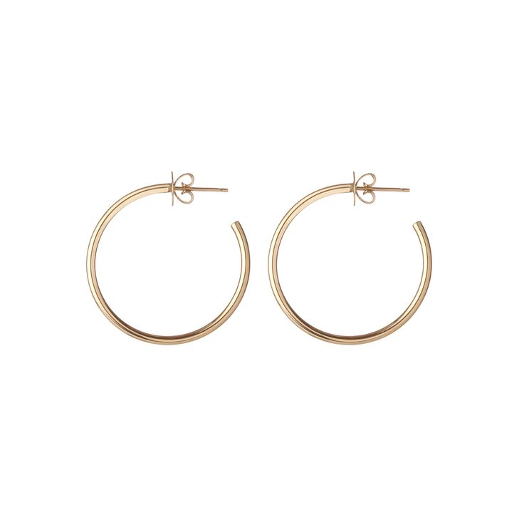 A hollow hand formed 1" hoop earring made from 14k gold. Sold as a pair. Hoop Earrings In 14k Gold, 14k Gold Hoop Earrings With Polished Finish, 14k Gold Single Hoop Earring, Classic Pierced Hoop Earrings In 14k Gold Filled, Small Hoop Yellow Gold Earrings, Classic 14k Gold Filled Pierced Hoop Earrings, Pierced Yellow Gold Hoop Earrings, 14k Gold Polished Hoop Earrings For Everyday, Yellow Gold Pierced Hoop Earrings