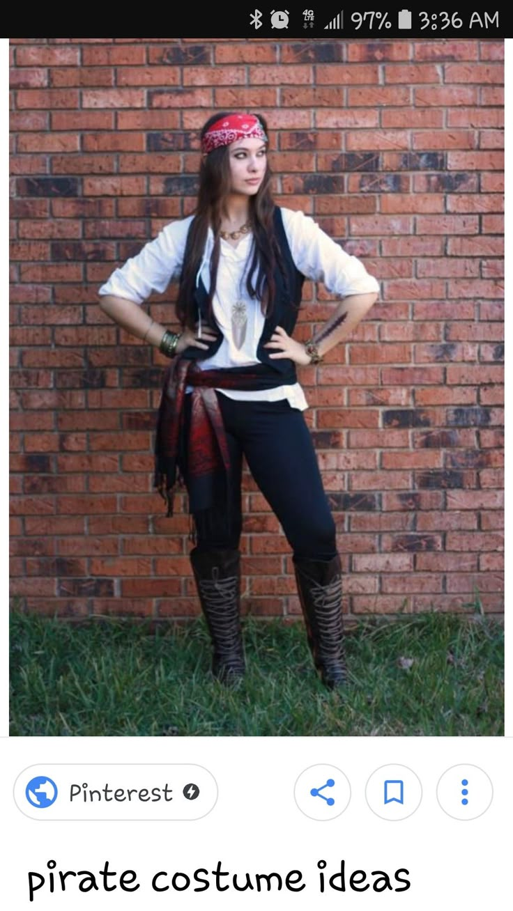 a woman standing in front of a brick wall wearing pirate costume and bandanna headband