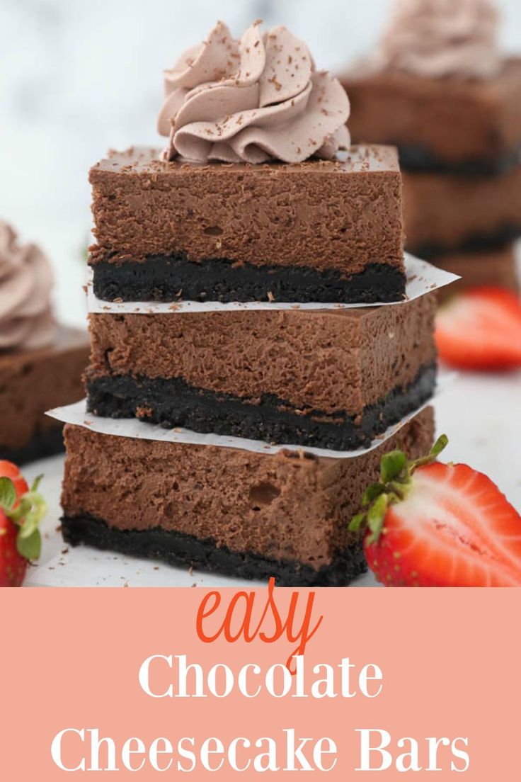 chocolate cheesecake bars stacked on top of each other with strawberries in the background