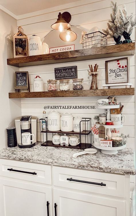 a kitchen with white cabinets and shelves filled with coffee cups, mugs and other items