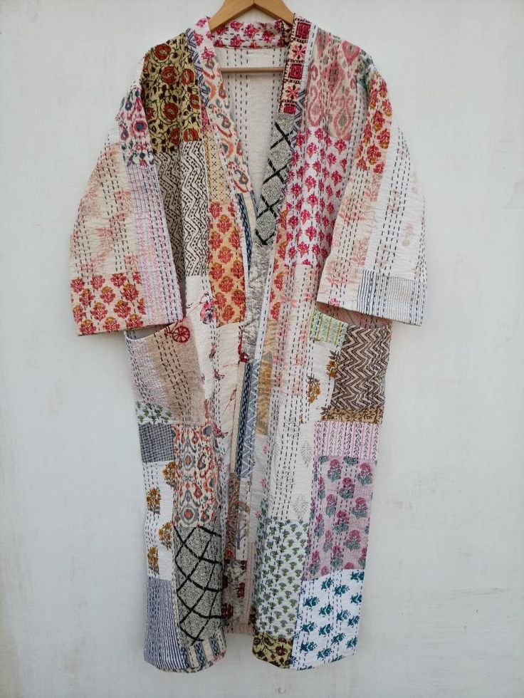 This Kimono is made of hand Kantha stitch fabric in patchwork . The fabric is a handmade printed fabric. Kantha stitch over the fabric gives it a unique look. It is two Layer of Cotton Kantha Stitch (Hand Quilted) Fabric Robe Size : Free size Length: 50 Inch ( 125 Cms.). Note: Due to patchwork theme there may be little difference in patches and color combination. Bog Coats, Quilt Coats, Night Wear Dress, Kantha Silk, Recycled Dress, Patchwork Fashion, Kantha Fabric, Boho Denim, Kantha Jacket