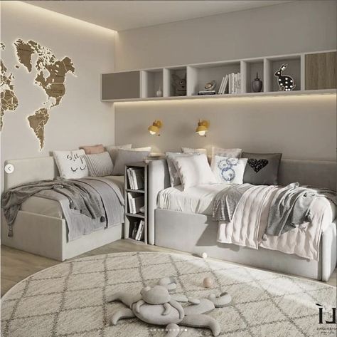 a bedroom with two beds and a world map on the wall above it, in front of a white rug