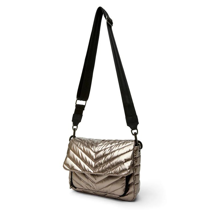 She is everything you want to be! Meet the Muse….the handbag everyone will desire. Your handbag and wallet all in one…this modern silhouette is the new bag on the block and we are obsessed. From the chevron quilting to multiple handle options to the insane amount organization…The Muse is here. Bag exterior: 100% polyester Bag interior: 100% polyester Lightweight quilted polyfill Top zipper closure Flap top with single snap closure Outside pocket: Back slip pocket with single snap closure Inside pockets: zipper pocket, 2 slip pockets Front attached zip-around wallet: center zipper pocket, multiple card slips Includes 3 detachable straps Height: 8" Depth: 10.5" Width: 3" 3 detachable straps included: Luxe hard handle 7" drop Chain handle 9" drop Adjustable and detachable crossbody luxe trim Gold Quilted Travel Bag, Modern Quilted Crossbody Shoulder Bag, Chic Quilted Flap Bag For Everyday Use, Chic Quilted Flap Bag For Travel, Quilted Shoulder Flap Bag For Travel, Rectangular Quilted Flap Bag For Travel, Modern Quilted Crossbody Bag, Quilted Flap Shoulder Bag For Everyday Use, Everyday Quilted Flap Shoulder Bag