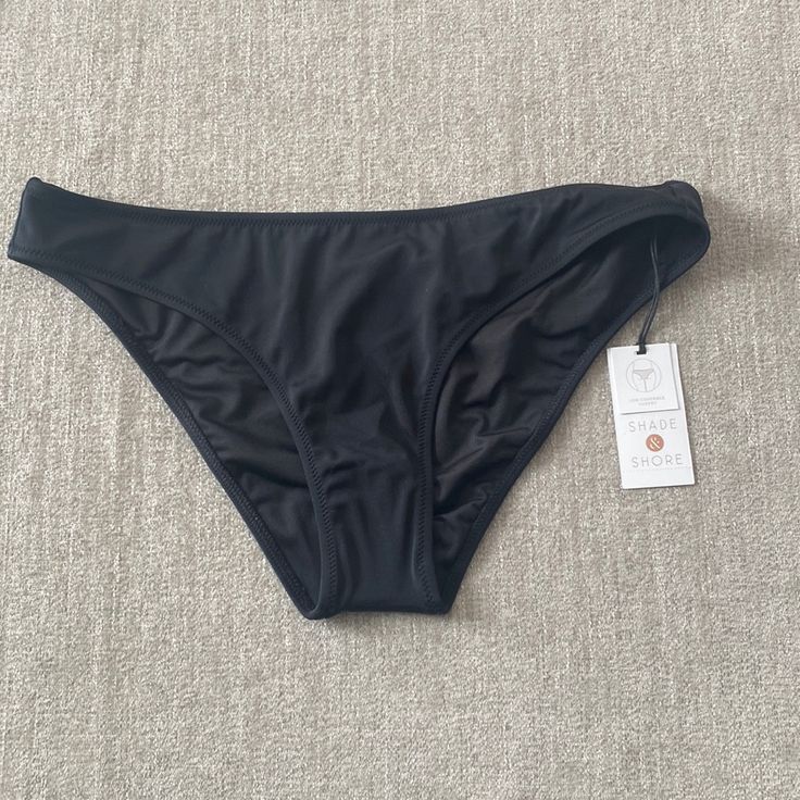 Shore & Shade Black Bikini Bottoms Size Medium Nwt. Fitted Black Seamless Swimwear, Black Swimwear Briefs For Sunbathing, Black Stretch Tankini With Brief Bottom, Black Stretch Tankini With Brief, Black Brief Tankini For Poolside, Black Tankini For Poolside, Black Beach Bottoms With Lined Body, Black Seamless Bottoms For Beach Season, Fitted Black Bottoms For Beach Season