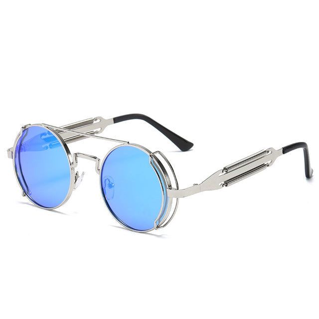 These Dani Joh sunglasses are the perfect. The Sunglasses are equipped with blue circle lens sunglasses. These circle will allow you to truly add a piece of perfection to your sunglass collection. Enjoy these exclusive sunglasses and show us how you'll rock them by using the hashtag #ShopDaniJoh. Sunglasses Features: Exclusive Round Sunglasses Polarized Blue Transparent Lens Metal frame design UV Protection Polycarbonate Lens One Size Sizing: 140mm x 50mm Retro Blue Sunglasses For Outdoors, Retro Sunglasses Men, Small Round Sunglasses, Perfect Sunglasses, Round Eyewear, Unique Sunglasses, Steampunk Sunglasses, Sunglasses Round, Round Frame Sunglasses