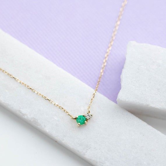 A dainty necklace in 14K gold with natural emerald and diamond in cluster set. This necklace is ideal as everyday jewelry and a great option for a birthday gift as emerald is May birthstone. D E T A I L S● Metal: 14K solid gold, 14K white gold or 14K rose gold● Gemstones: Emerald, round cut 3mm, Diamond, brilliant cut, 2mm● Gemstones Weight: 0.10 ct, 0.03 ct● Length: 40 cm - 16 inchesH O W ∙ T O ∙ O R D E RChoose from the drop-down menu the available options (Metal) and leave us a note for any s Dainty 14k Gold Emerald Necklace, Dainty 14k Gold Emerald Necklace For Anniversary, Yellow Gold Diamond Necklace For May Birthstone, Dainty Yellow Gold Emerald Necklace For Anniversary, Dainty Yellow Gold Emerald Necklace, Dainty Emerald Birthstone Necklace For May, Fine Jewelry Diamond Necklace For May Birthstone, Fine Jewelry 14k Gold Emerald Birthstone Necklace, 14k Gold Emerald Birthstone Necklace