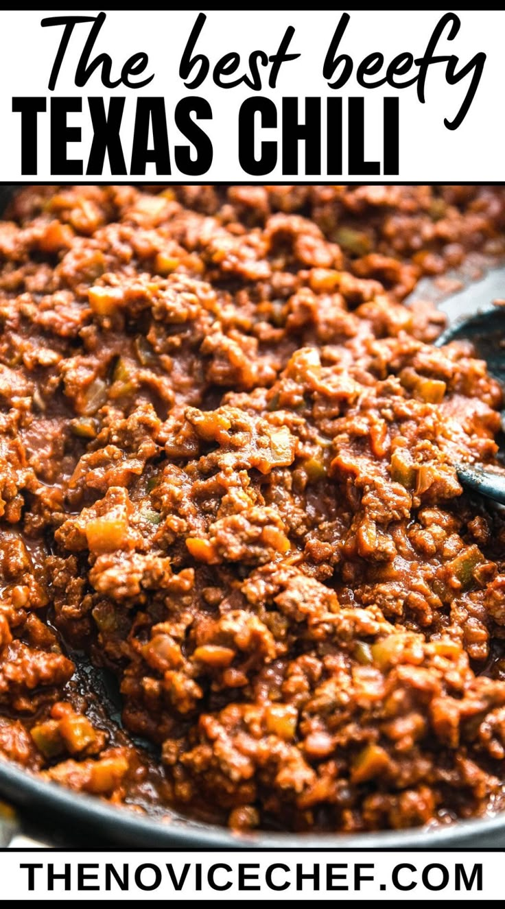 the best beefy texas chili in a skillet with text overlay that reads, the best beefy texas chili