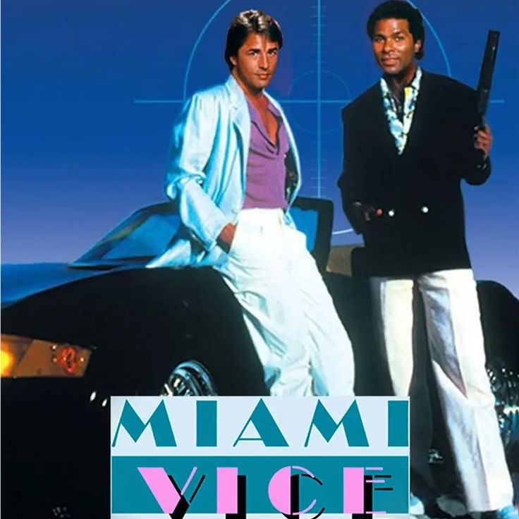 two men standing next to each other in front of a car with the words miami vice on it