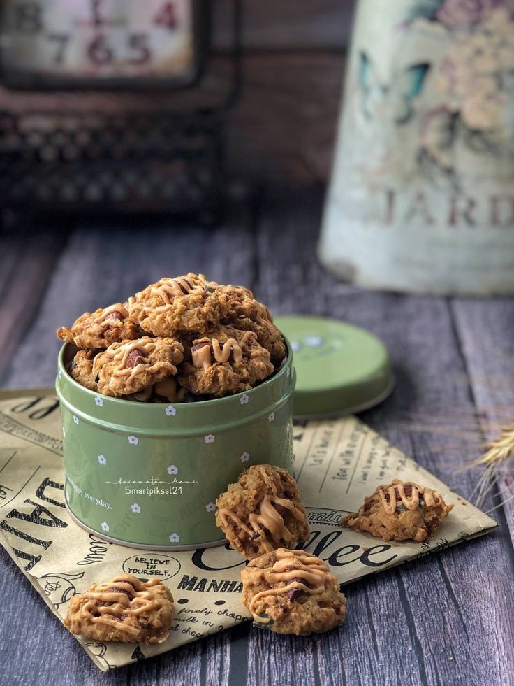 some cookies are in a green bowl on a table