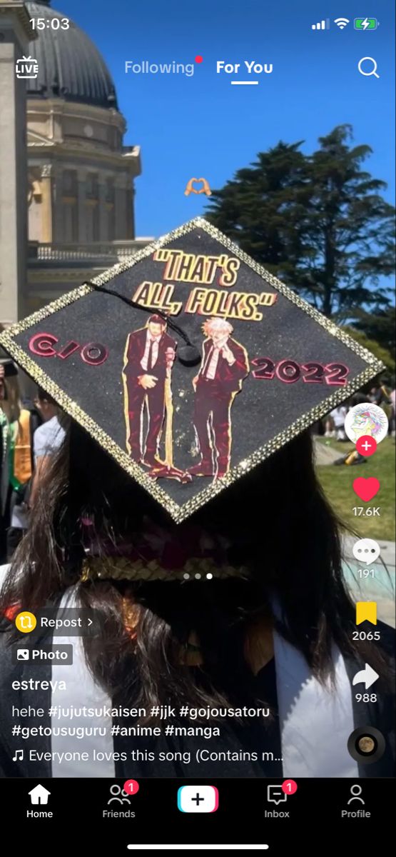 a person wearing a graduation cap with the words that's all folks on it