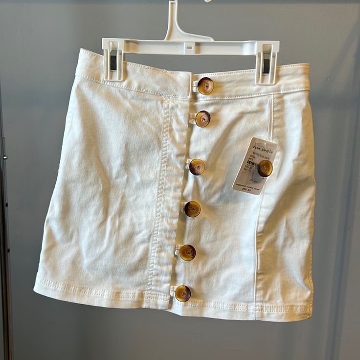 White Free People Mini Skirt With Buttons Up The Front. Stretch Denim Like Material. New With Tags Never Worn White Mini Skirt With Button Closure For Summer, White Cotton Denim Skirt For Day Out, White Casual Mini Skirt With Buttons, White Mini Skirt With Button Closure For Spring, Casual White Mini Skirt With Button Closure, Casual White Denim Skirt For Day Out, Skirt With Buttons, Free People Skirt, Stretch Denim