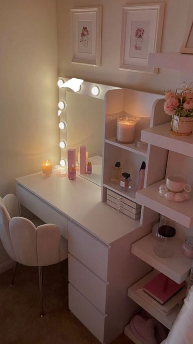 a white desk topped with a vanity mirror and lots of lights on top of it