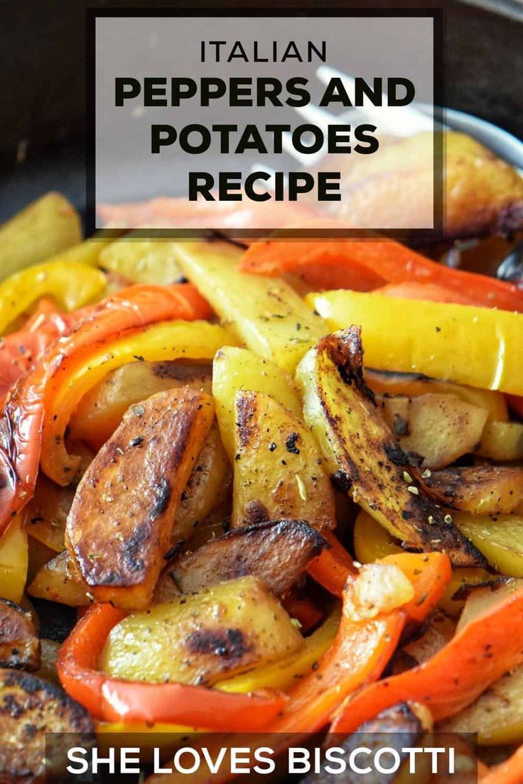 a pan filled with peppers and potatoes on top of a table