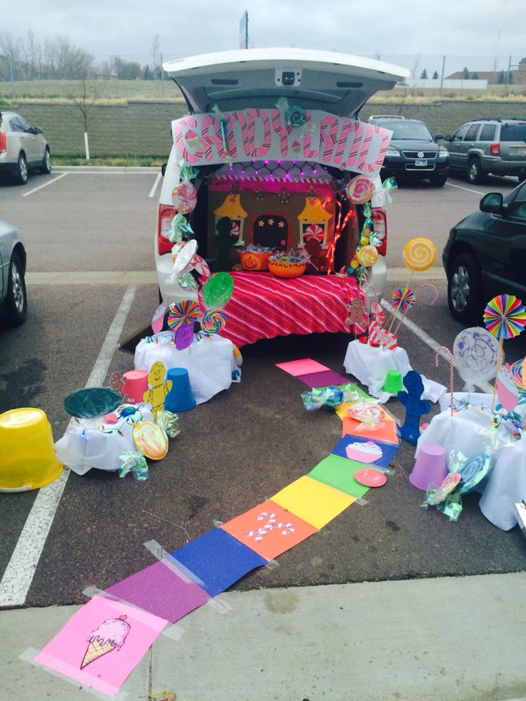 the trunk of a car decorated with candy and decorations