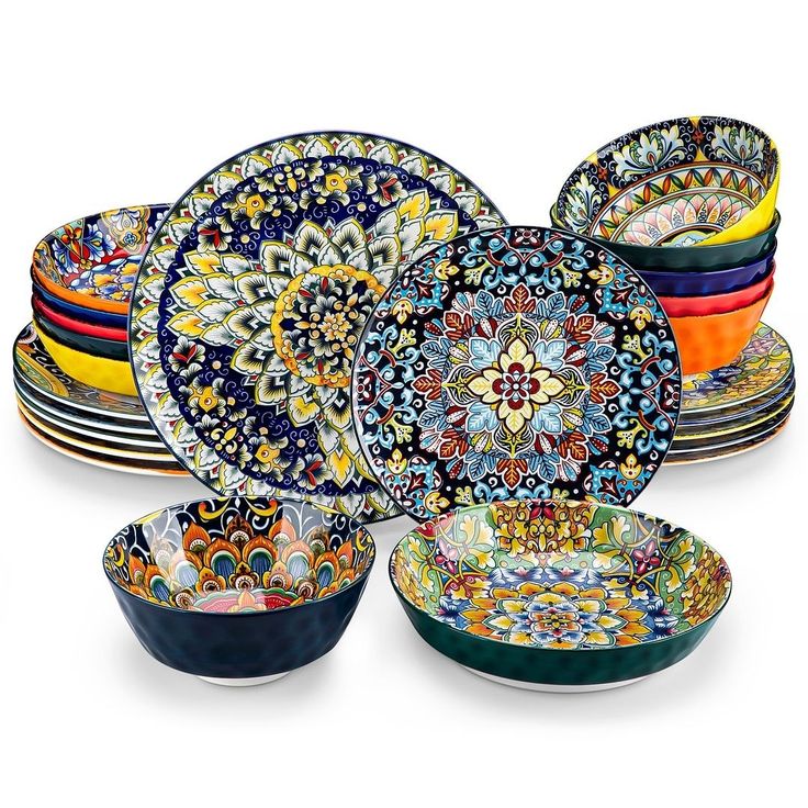 a bunch of colorful plates stacked on top of each other in different colors and designs