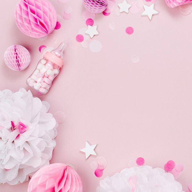 pink and white decorations on a pink background