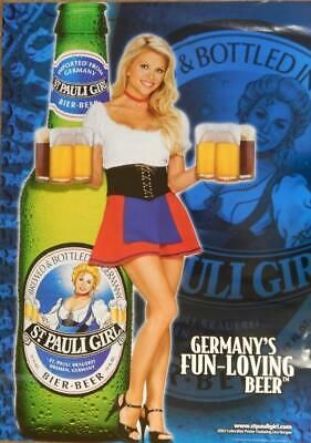 a woman holding two beer mugs in front of a poster for the german beer company