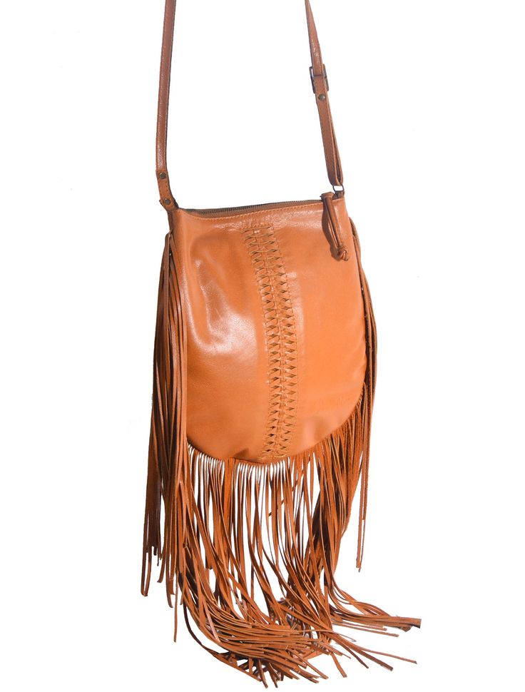 Sayang Fringe Crossbody. Beauty lies in the details and this sublime handcrafted, handwoven Crossbody bag has plenty. Our Balinese Artisans intricately weave rich soft genuine leather to create an exquisite Bohemian statement piece with the added fringe that will have heads turning. Whether at the farmers market with the kids or attending a summer festival, this decorative beauty will be your everyday companion adding a unique edge to your favorite jeans or feminine floral dress. Featuring a lea Midnight Black, Balinese, Summer Festival, Favorite Jeans, Farmers Market, Statement Pieces, Bucket Bag, Turning, Crossbody Bag