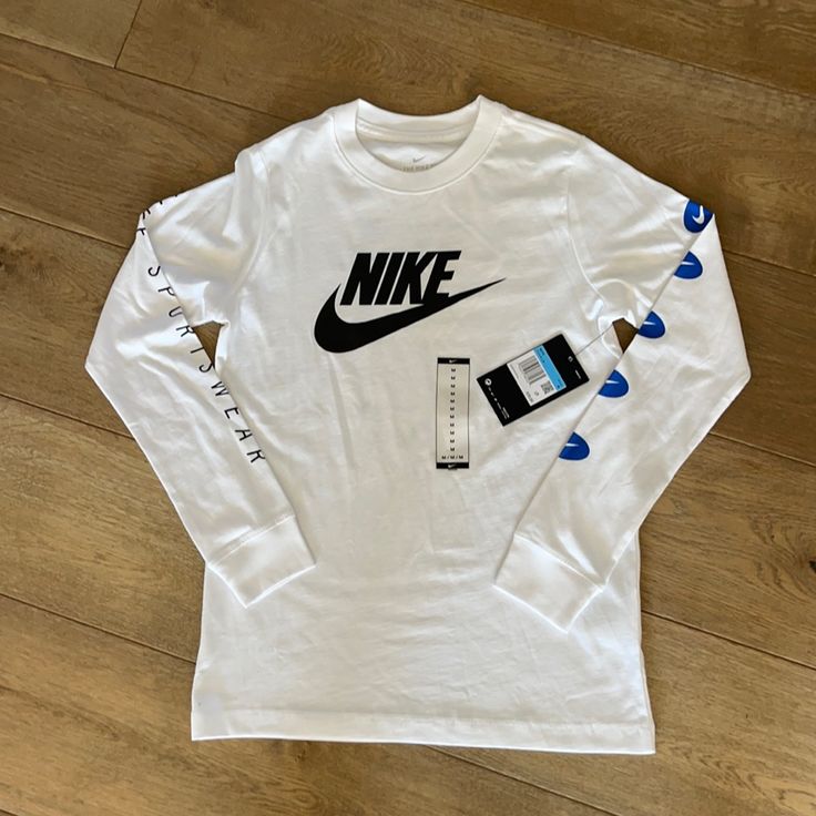 Nwt Nike Long Sleeve T-Shirt Size M Nike Cotton Long Sleeve T-shirt, Nike White Cotton Shirt, Nike White T-shirt With Letter Print, Nike Sporty White Shirt, Sporty Pre-shrunk White Shirt, White Long Sleeve Graphic Tee, Pre-shrunk Long Sleeve White Shirt, Pre-shrunk White Long Sleeve Shirt, Nike Pro Fits