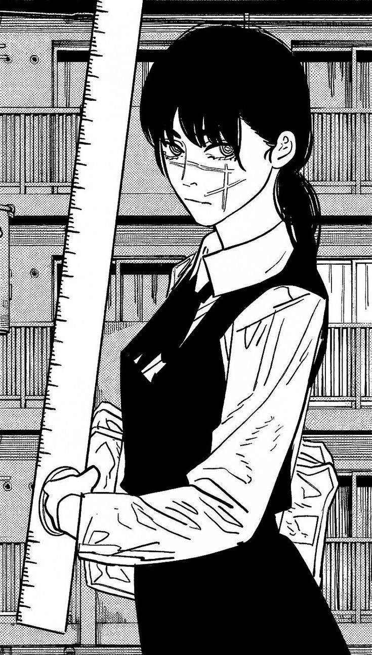 a woman holding a large ruler in front of bookshelves