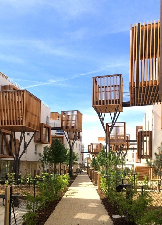 the walkway is lined with wooden balconies