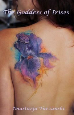 the back of a woman's shoulder with flowers painted on it