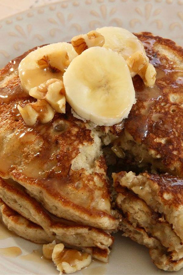 pancakes with bananas and syrup on a plate