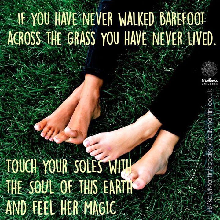 two feet in the grass with a quote on it that says, if you have never walked barefoot across the grass you have never lived lived