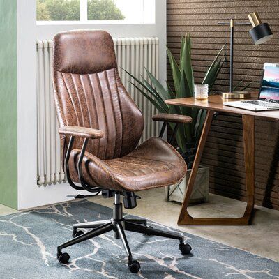 an office chair sitting in front of a desk with a laptop computer on top of it