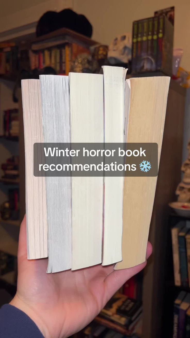 someone holding three books in their hand with the words winter horror book recommendeds written on them