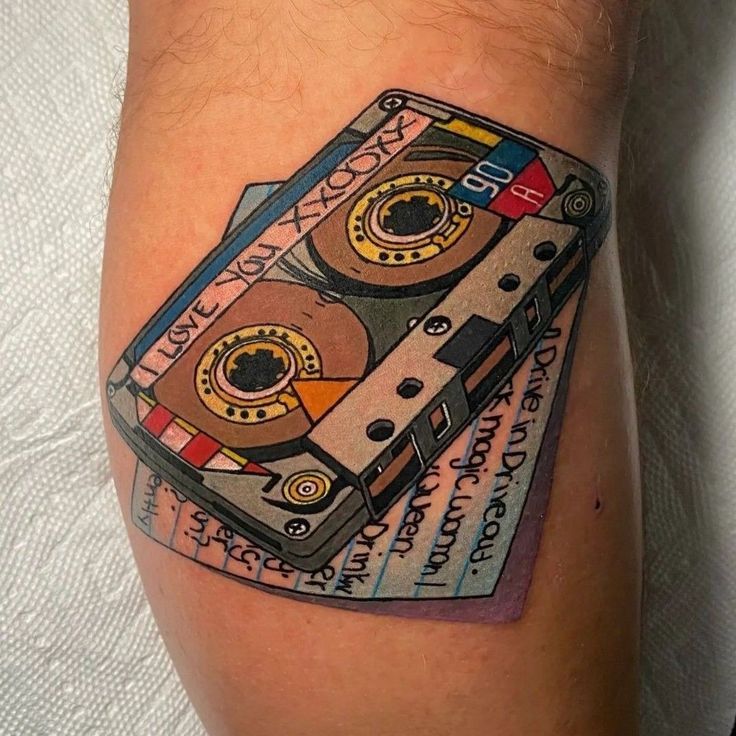 a tattoo with a cassette tape on it