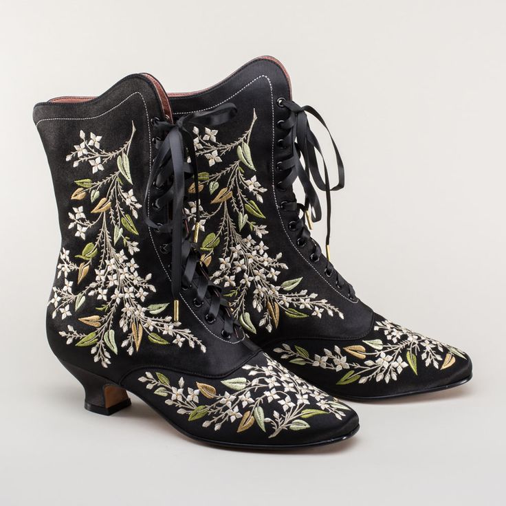 Now available in wide width! Indulge in a piece of history with Flora Embroidered Boots, an exclusive reproduction of the intricate opera and evening boots popular in the late Victorian period. Expertly crafted with intricate botanical detailing, these stunning satin boots will take you back to an era of sophistication and finesse. Wear them with bustle and Belle Epoque attire from the 1870s to c. 1900, or with modern dress as a statement piece. The Flora Boots are designed in collaboration with Satin Boots, Bata Shoes, American Duchess, Boots Wide, Oxford Pumps, Embroidered Boots, Oxford Boots, Victorian Period, Shoe Inserts