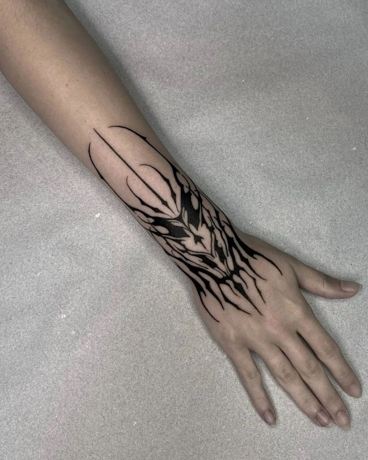 a person's hand with a tattoo on it